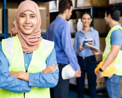 A team of distribution center employees discuss their quality control processes