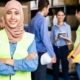 A team of distribution center employees discuss their quality control processes